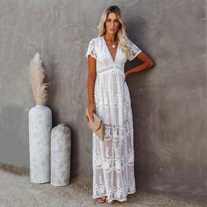 Elegant white lace maxi dress for women, featuring a V-neck and short sleeves, perfect for effortless summer style.