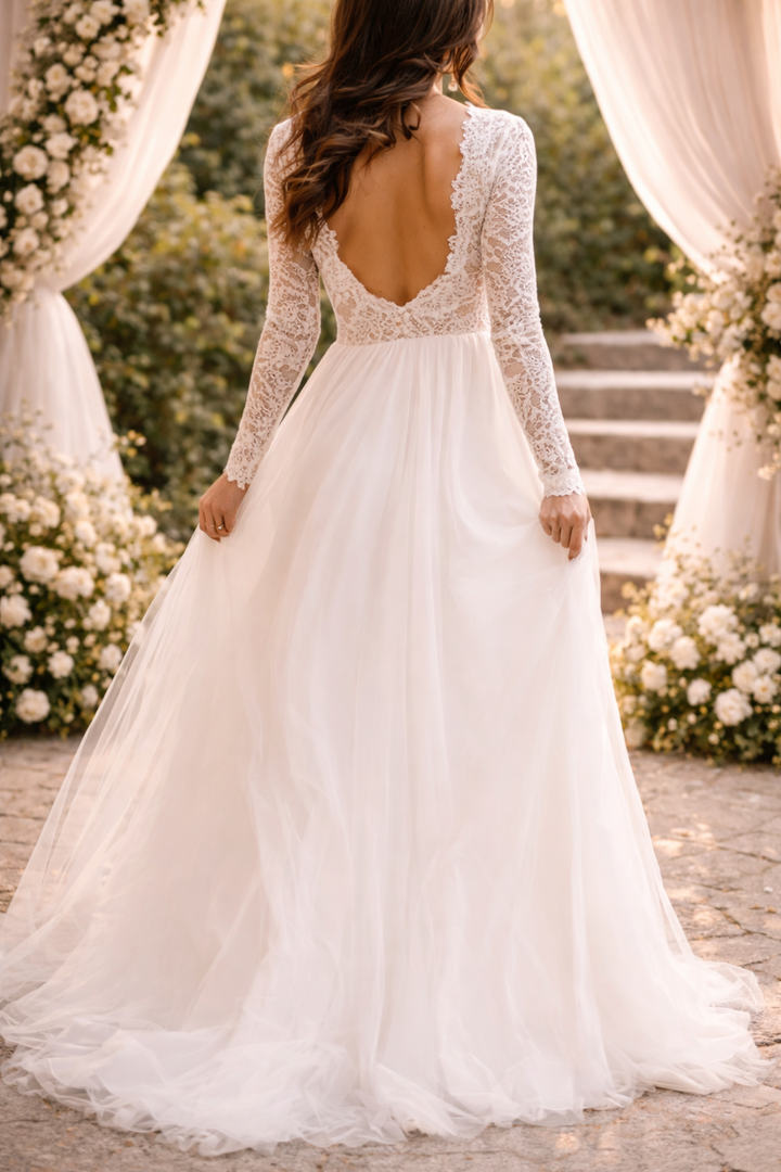 Formal women's long sleeve bridal gown. Elegant A-line white maxi dress for a timeless special occasion or reception.