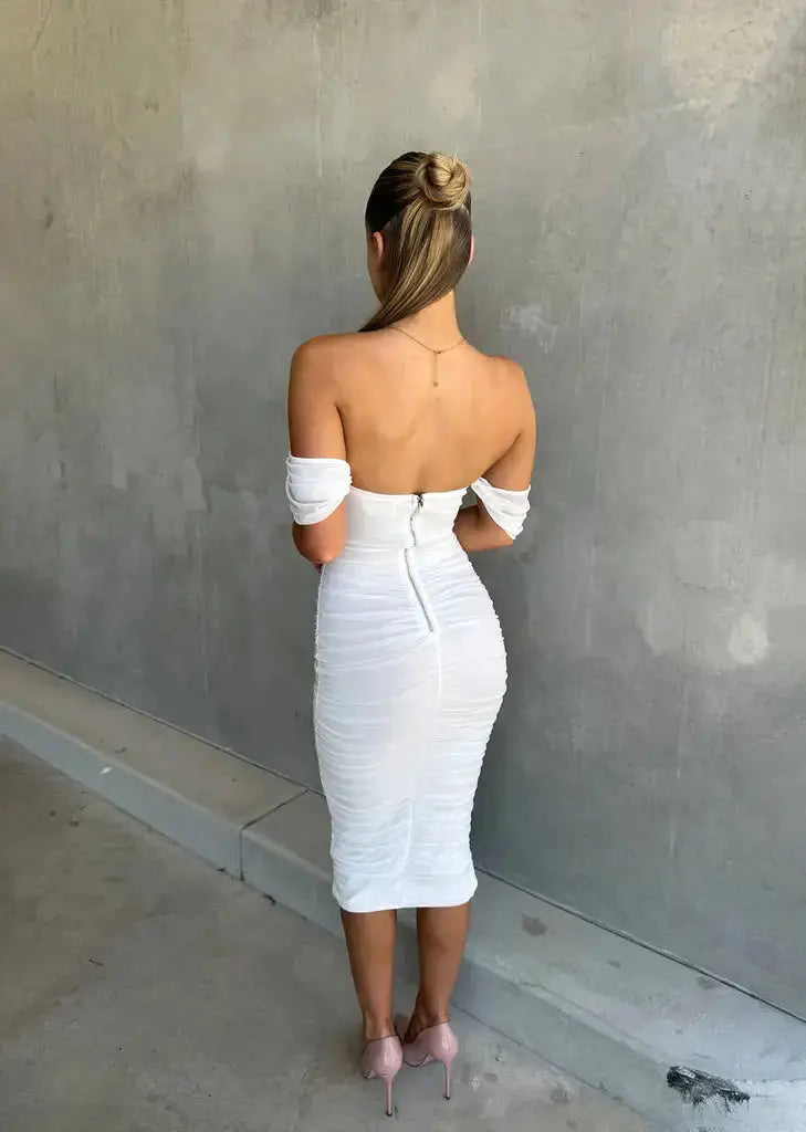Women's fitted white off-shoulder midi dress. Elegant bodycon style for evening wear & formal events.