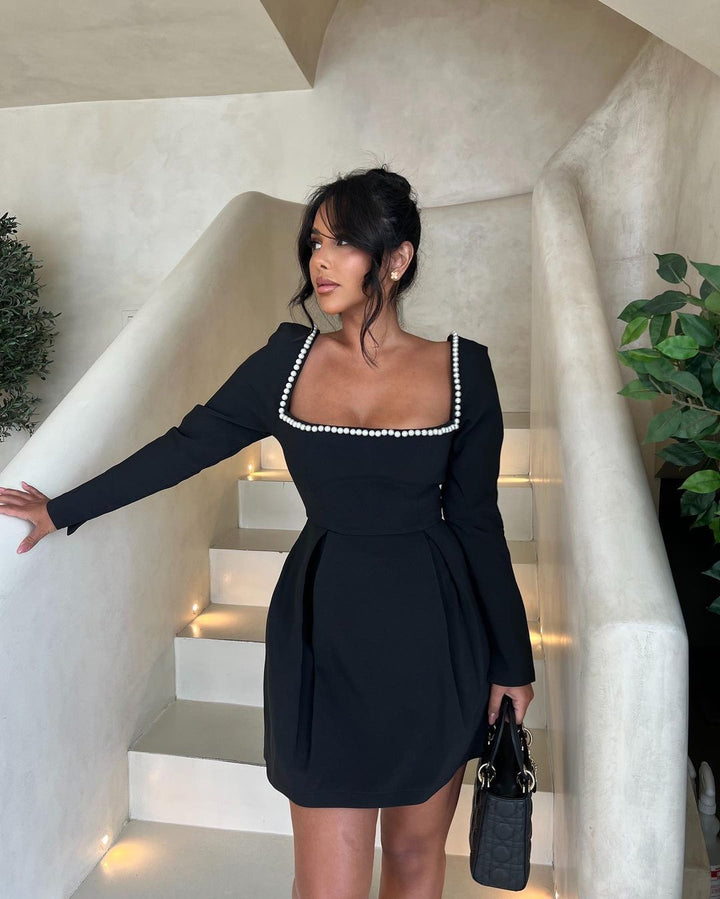Sophisticated women's pearl party dress with puff sleeves, ideal for girls' night out and sparkle season.