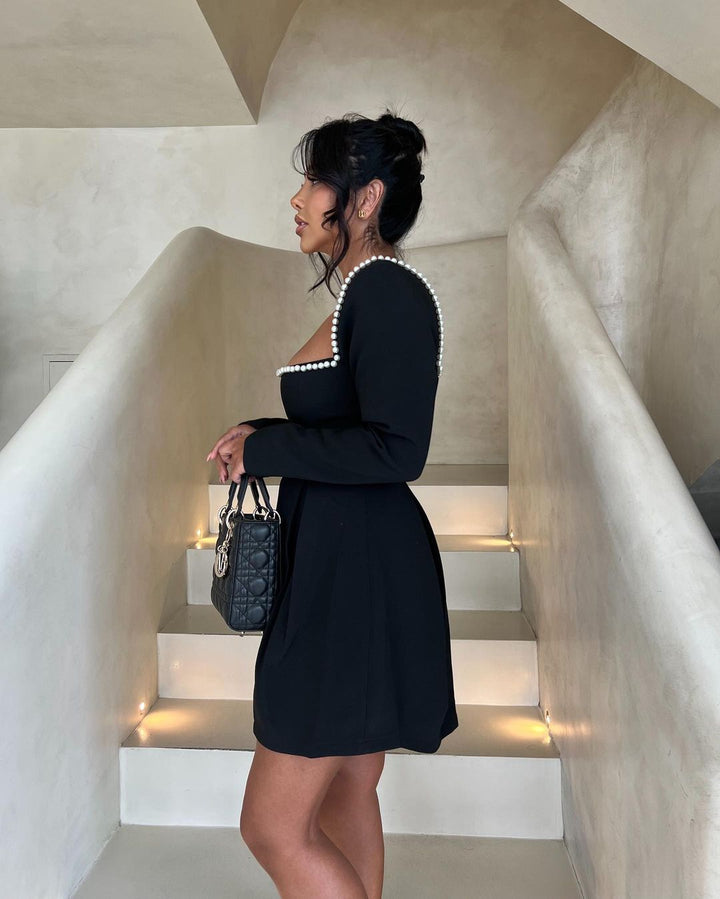 Luxurious pearl-embellished women's evening dress, featuring chic puff sleeves and an elegant square neckline.