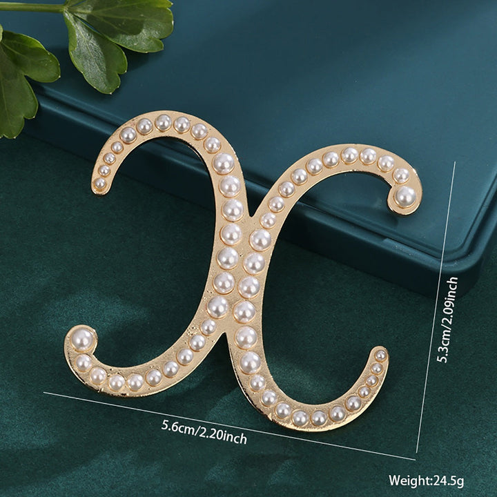 White pearl hair clip, a classic elegant choice for women.