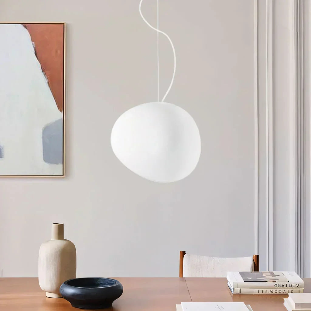 Chic white pebble pendant light brings elegant modern lighting to your home. Perfect minimalist decor accent.