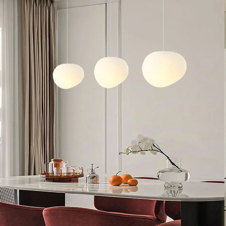 White pebble pendant light. Modern ceiling lamp for contemporary spaces, minimalist home lighting fixture.