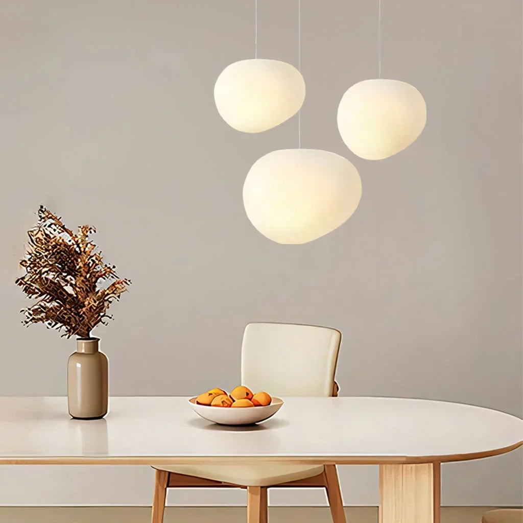 Sophisticated white pebble pendant light. Modern ceiling lamp, perfect for minimalist home decor & interior design.