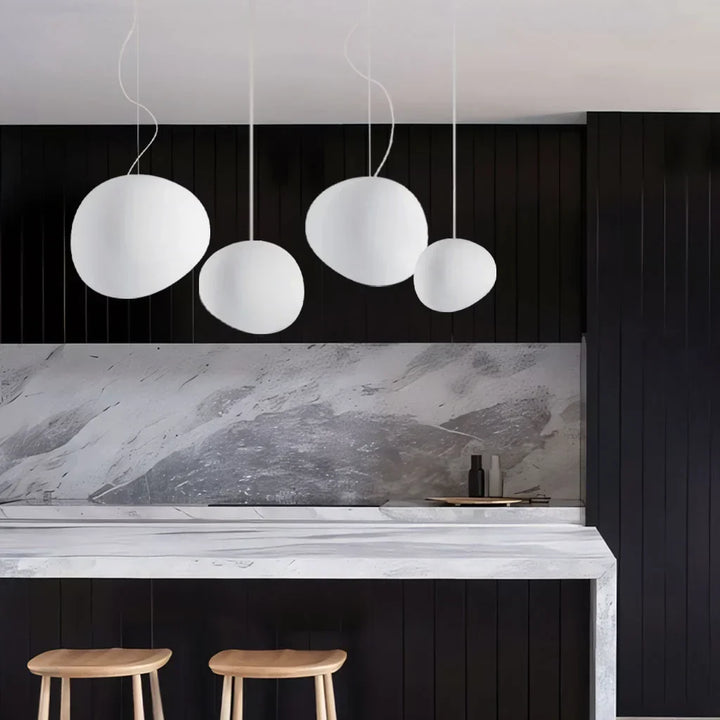 Beautiful white pebble pendant light. Modern ceiling lighting fixture, essential for elegant minimalist home decor.