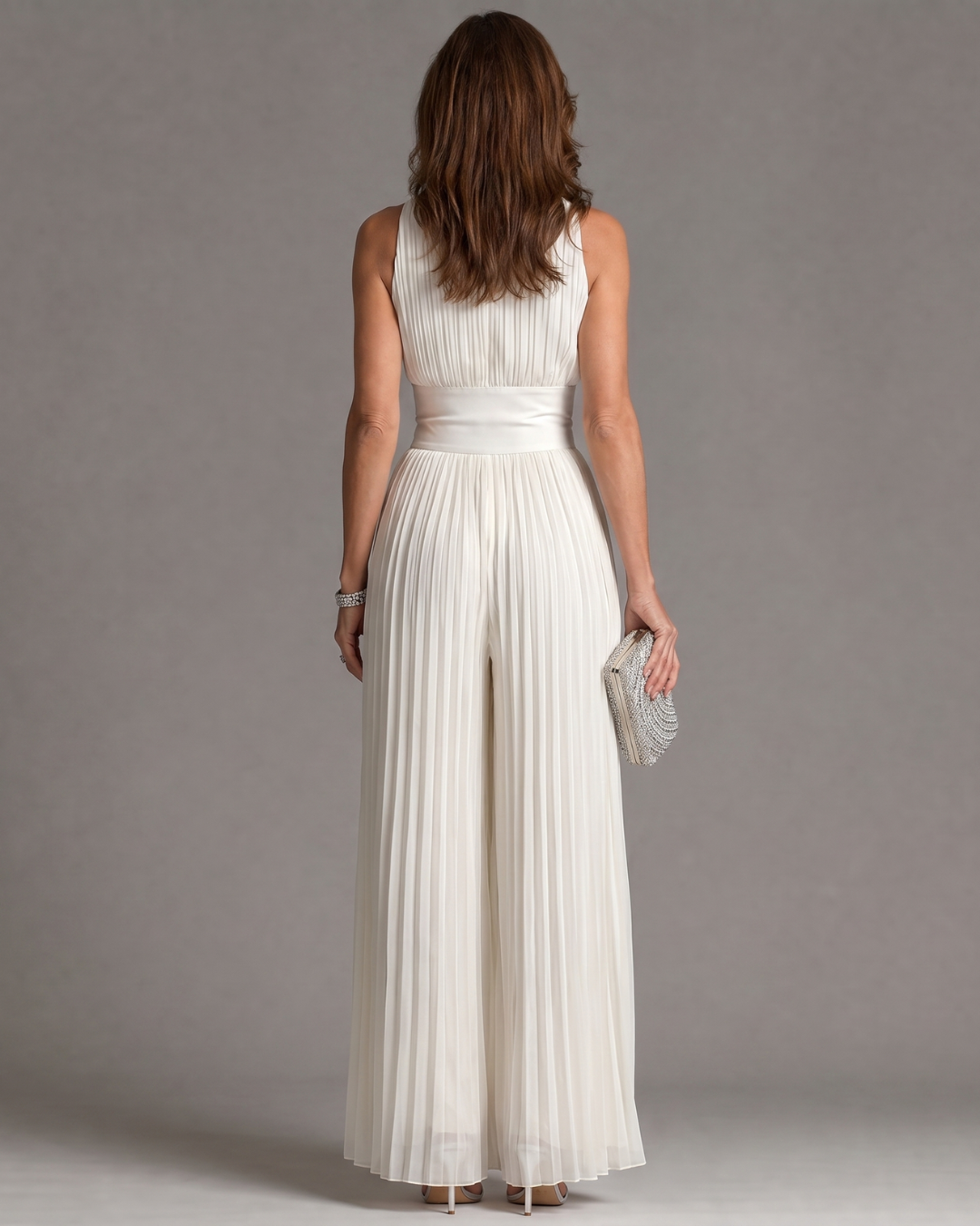 Sophisticated women's white pleated halter neck wide leg jumpsuit, perfect occasion wear for summer events.