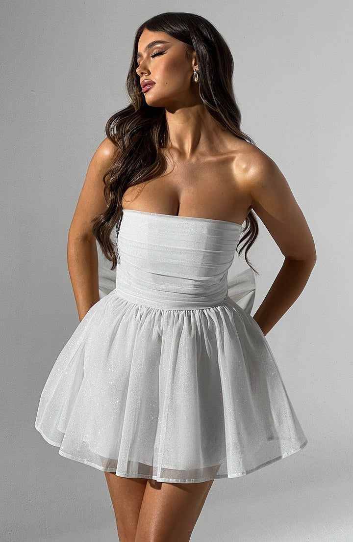 Clean white strapless mini dress, a sophisticated option for any festive celebration.