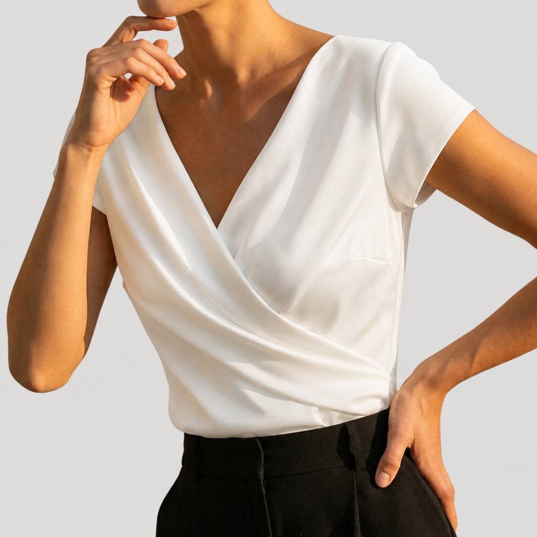 Khaki women's draped V-neck blouse, cap sleeve, wrap style. Versatile and chic for elegant fashion.