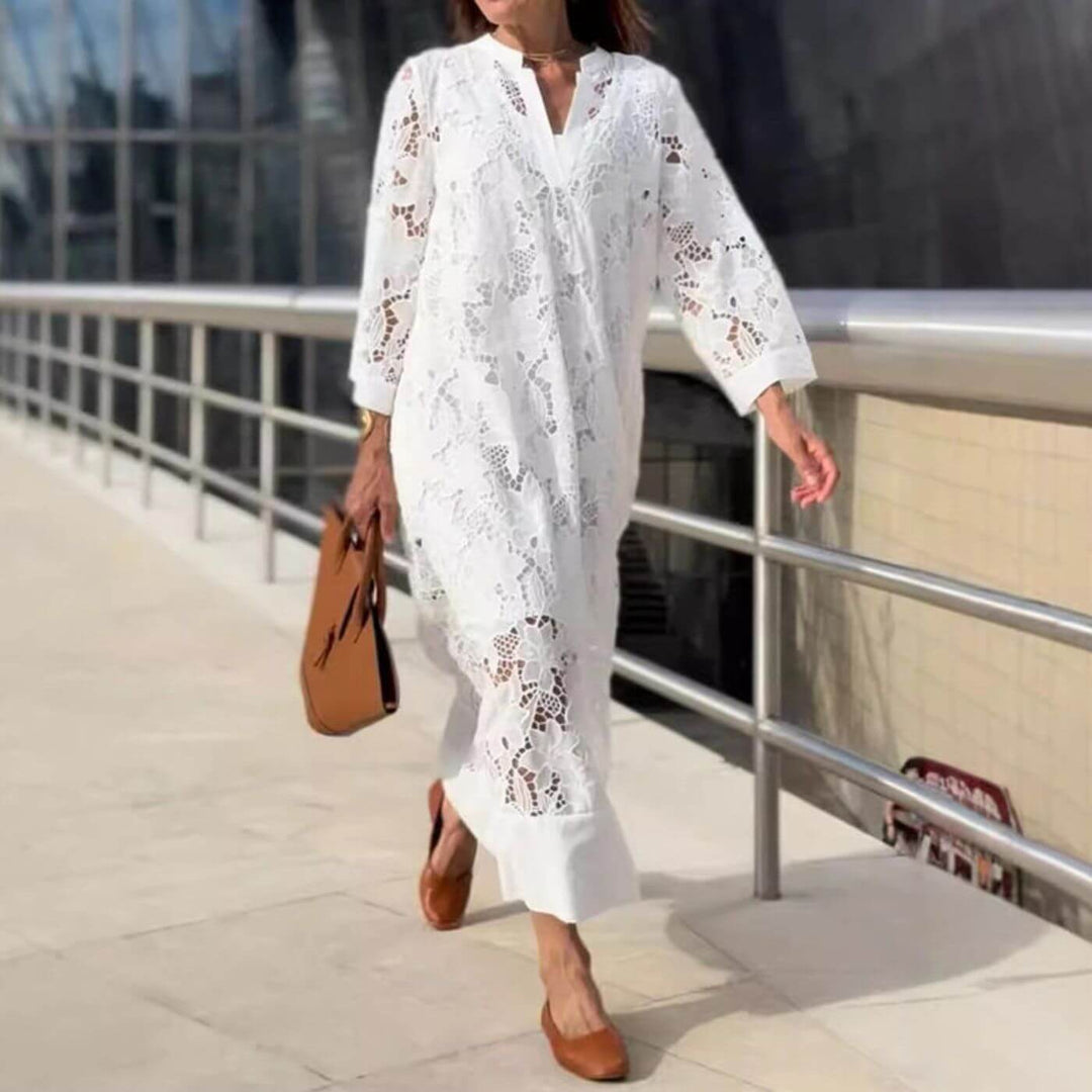 Elegant white women's lightweight maxi dress with loose sleeves & V-neck, ideal for summer and versatile styling.