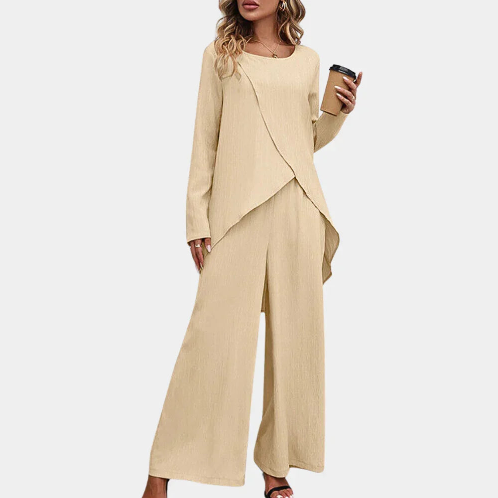 Versatile black women's pantsuit set with a chic blazer & elegant trousers. Ideal for professional & casual wear.