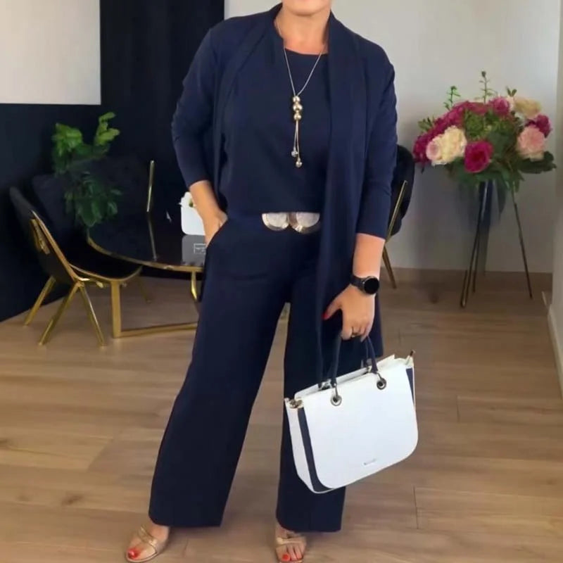 Stylish women's 3-piece set featuring a soft knit cardigan, camisole, and flowy wide-leg trousers outfit.