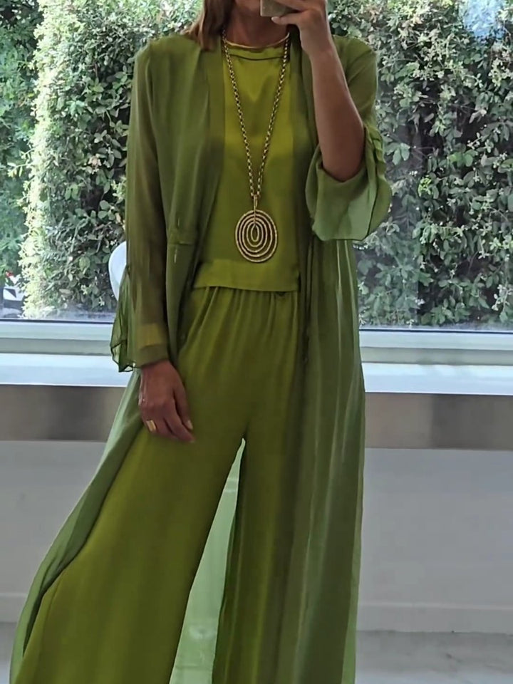 Comfortable women's green 3-piece lounge set with relaxed fit wide-leg pants, camisole, and long cardigan for leisure.