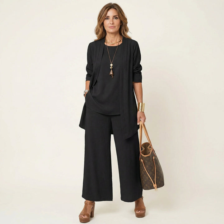 Elegant women's 3-piece minimalist outfit set with chic vest, blouse & wide-leg trousers for workwear.