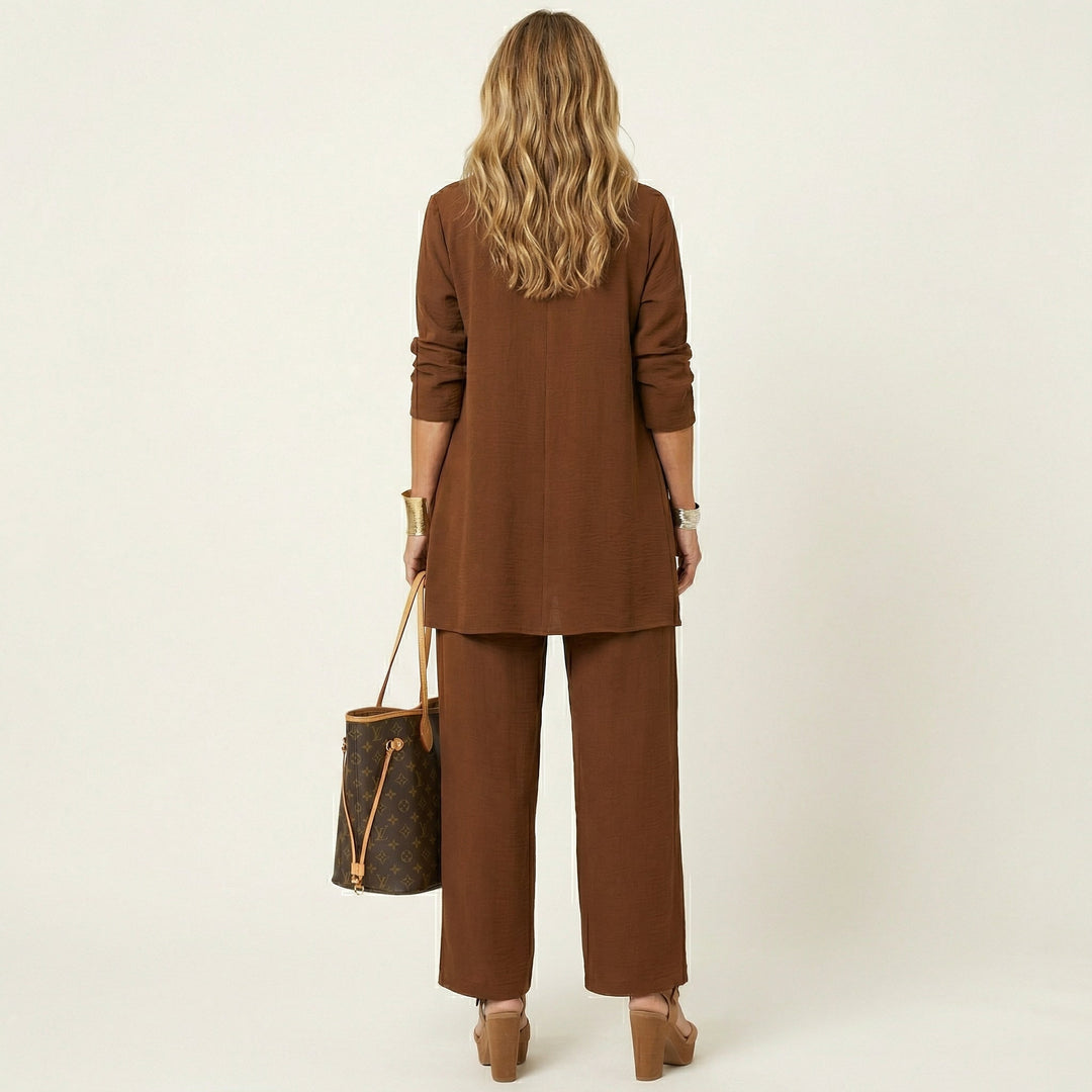 Versatile women's 3-piece set for work: chic vest, crisp blouse & modern wide-leg trousers.