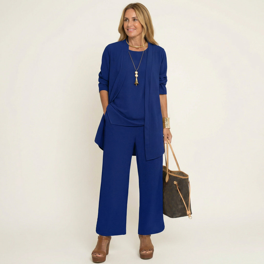Chic women's office attire: elegant 3-piece set featuring a vest, sophisticated blouse & flowing wide-leg pants.