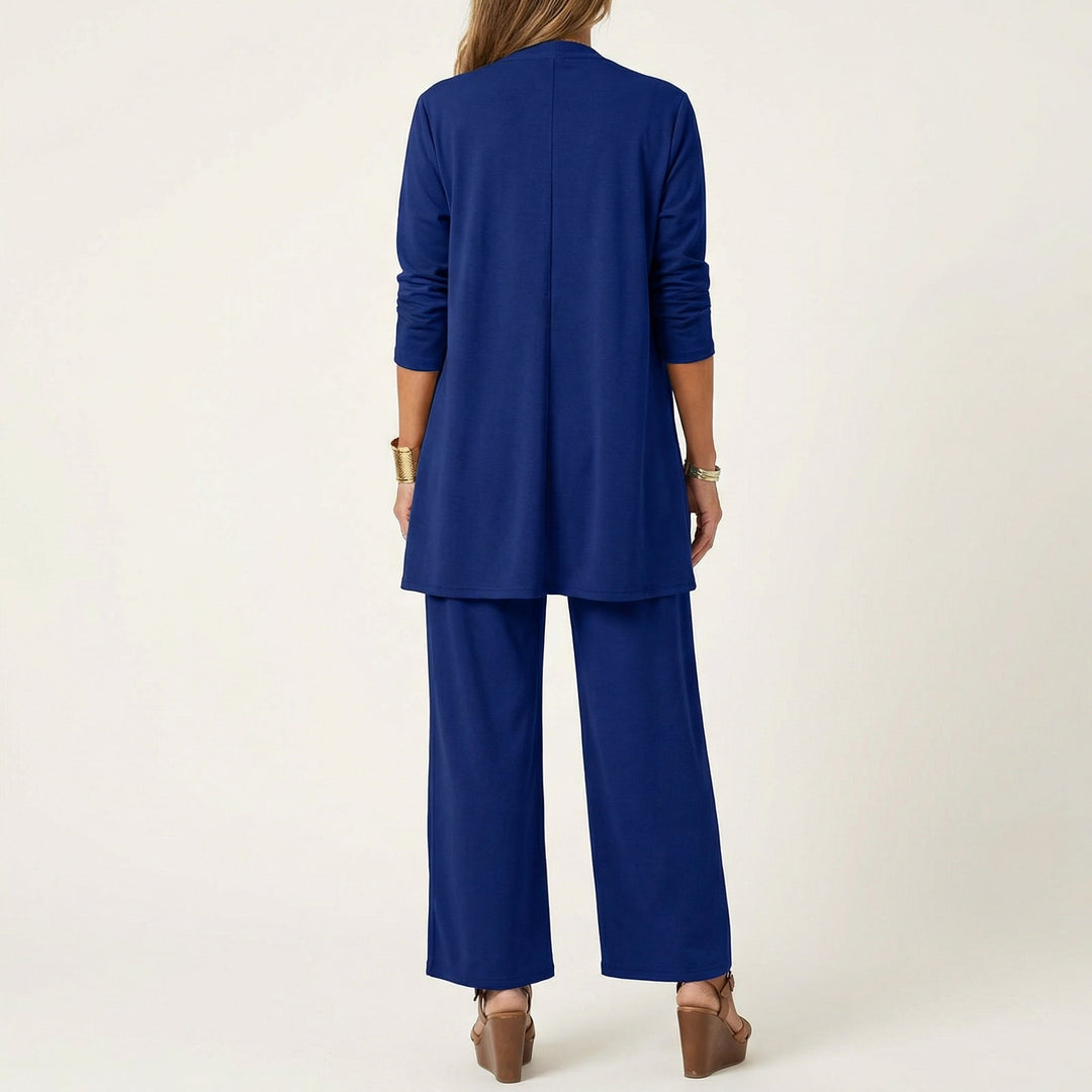Comfortable women's 3-piece outfit: minimalist vest, blouse & wide-leg trousers, perfect for work or casual.