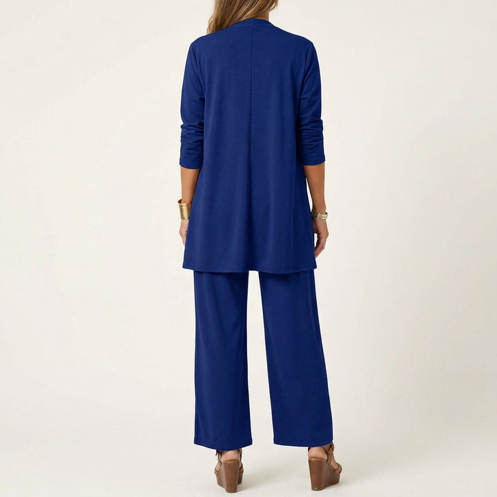 Comfortable women's 3-piece outfit: minimalist vest, blouse & wide-leg trousers, perfect for work or casual.