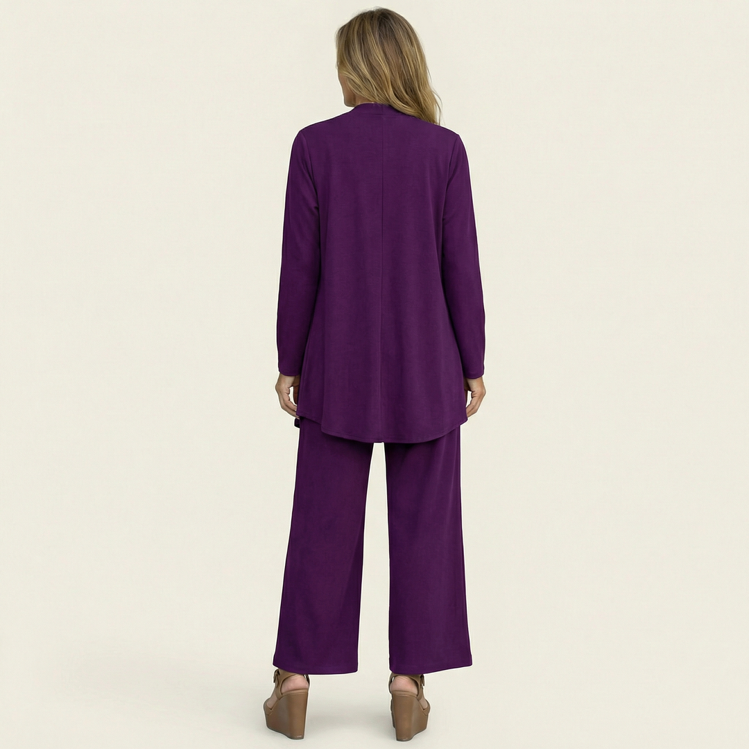 Minimalist women's workwear set: a versatile 3-piece outfit with a sleek vest, blouse & wide-leg trousers.