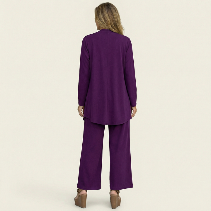 Minimalist women's workwear set: a versatile 3-piece outfit with a sleek vest, blouse & wide-leg trousers.
