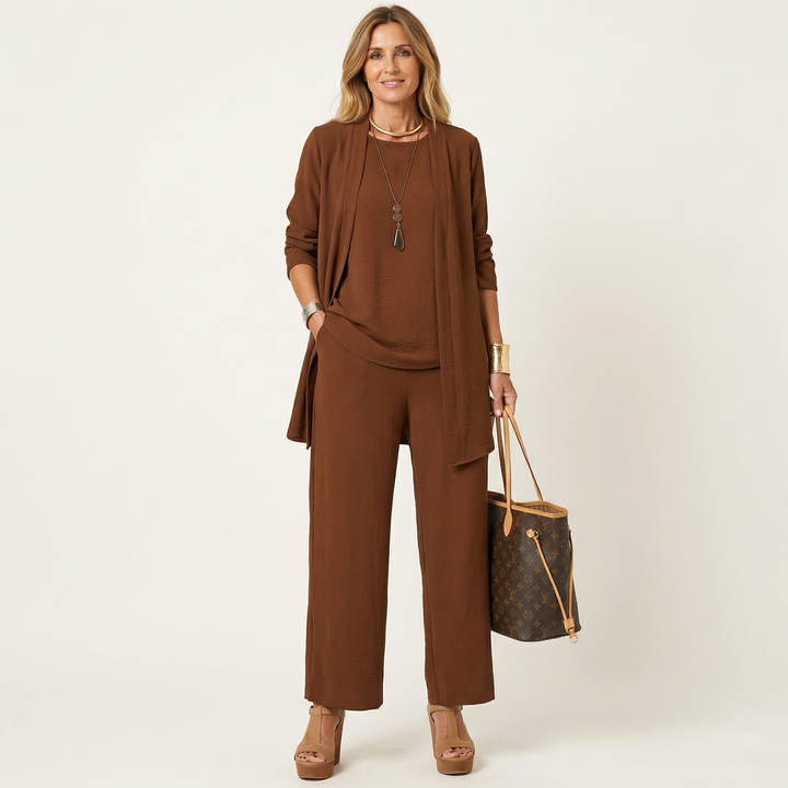 Elegant women's comfy 3-piece set: minimalist vest, sophisticated blouse & flowing wide-leg trousers.