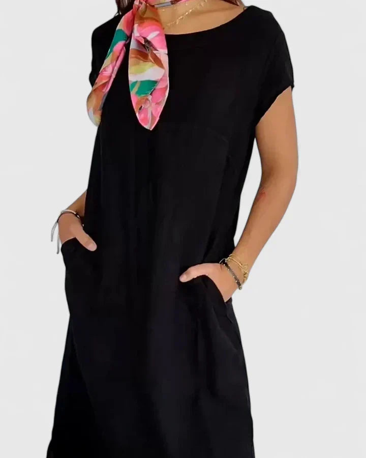 Elegant women's A-line dress featuring a comfortable fit and practical pockets for summer.