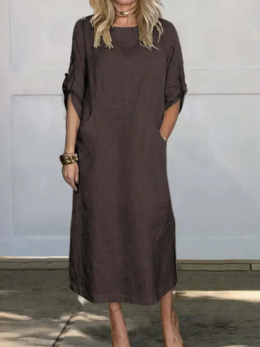 Women's elegant draped A-line evening dress. Back view showing flowy fabric, perfect for formal events.