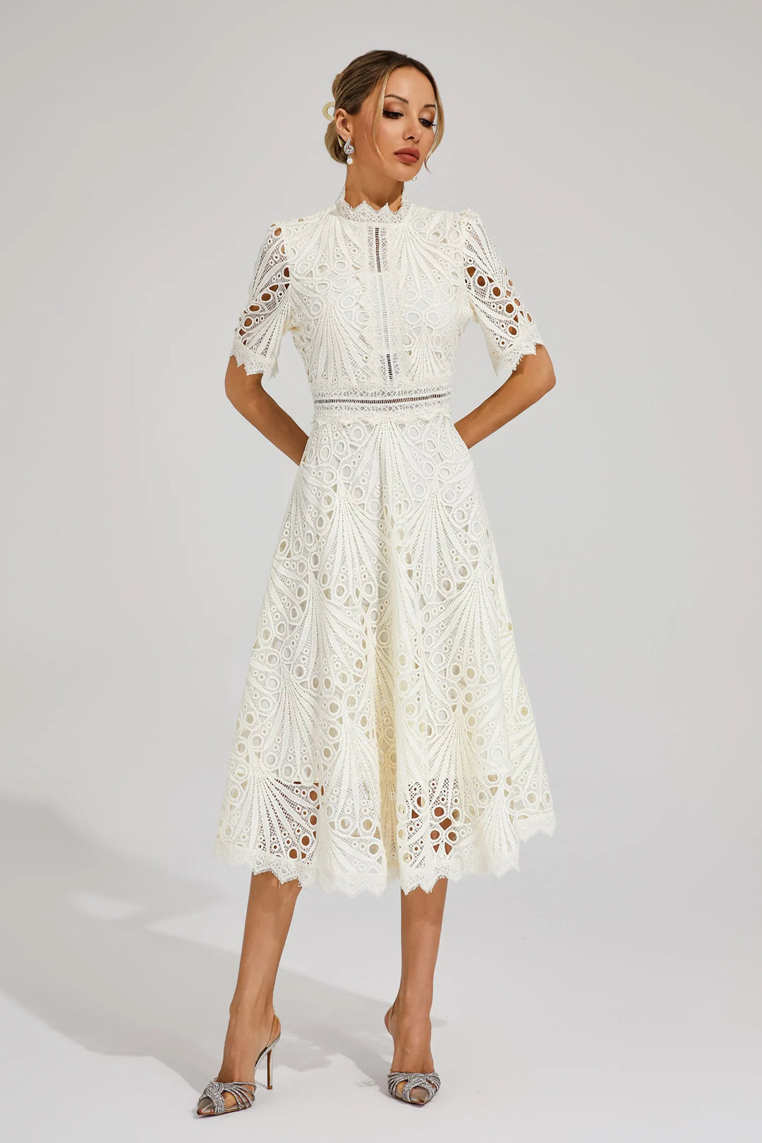 Full-length shot of women's elegant lace midi dress, A-line fit, short sleeve, mock neck, party ready.