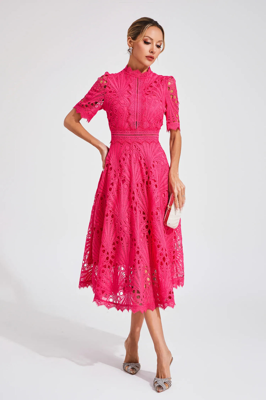Feminine lace midi dress with short sleeves, mock neck, & stylish cutout waist, A-line fit.