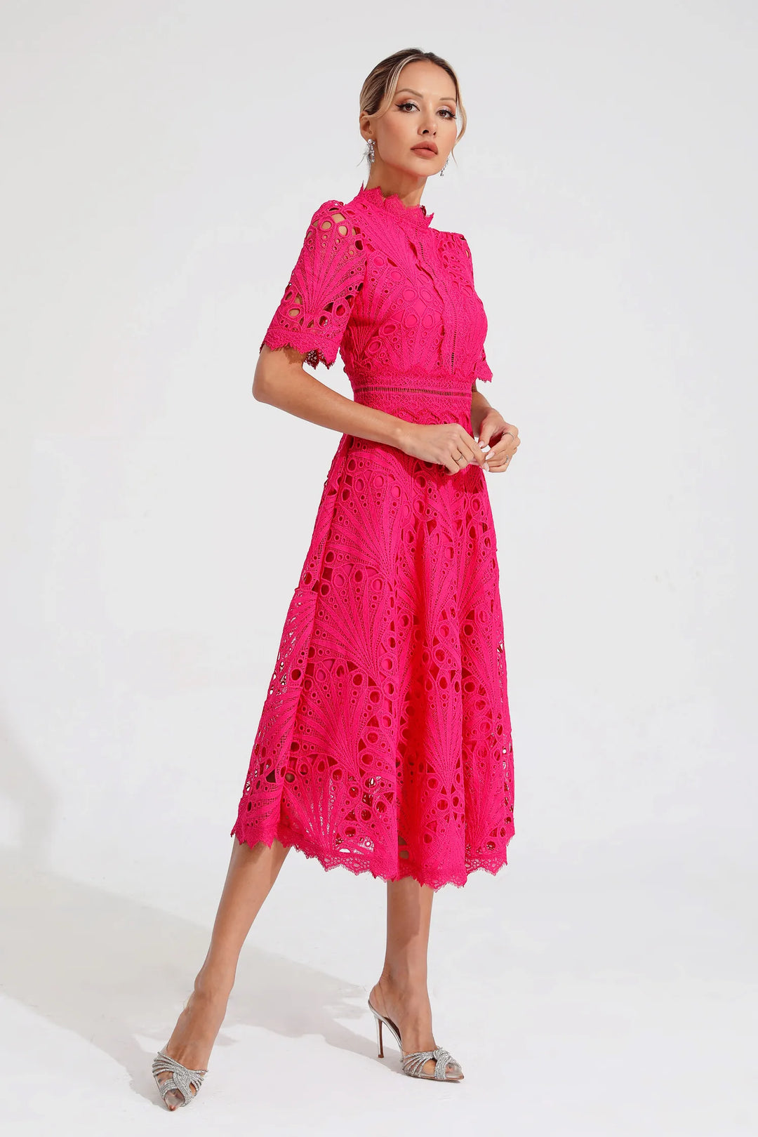 Close-up of delicate lace on women's elegant midi dress, A-line fit, short sleeve, mock neck.