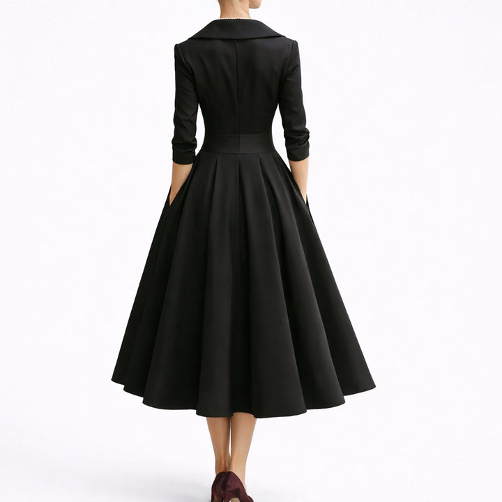 Sophisticated structured A-line midi dress for women. Autumn formal wear with three-quarter sleeves & pockets.