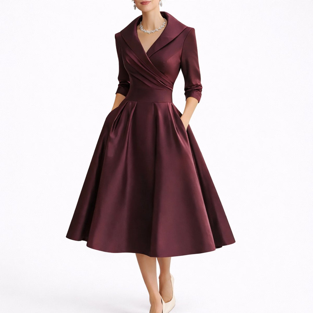 Formal V-neck A-line midi dress. Women's structured cocktail dress with three-quarter sleeves, ideal for fall.