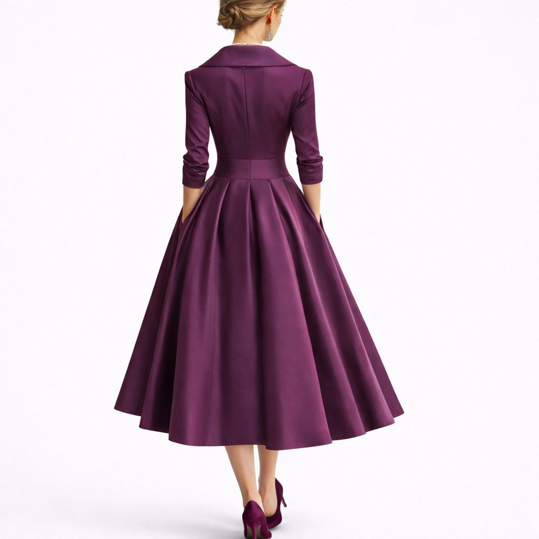Women's elegant structured A-line midi dress. Formal fall occasion wear with practical pockets & V-neck design.
