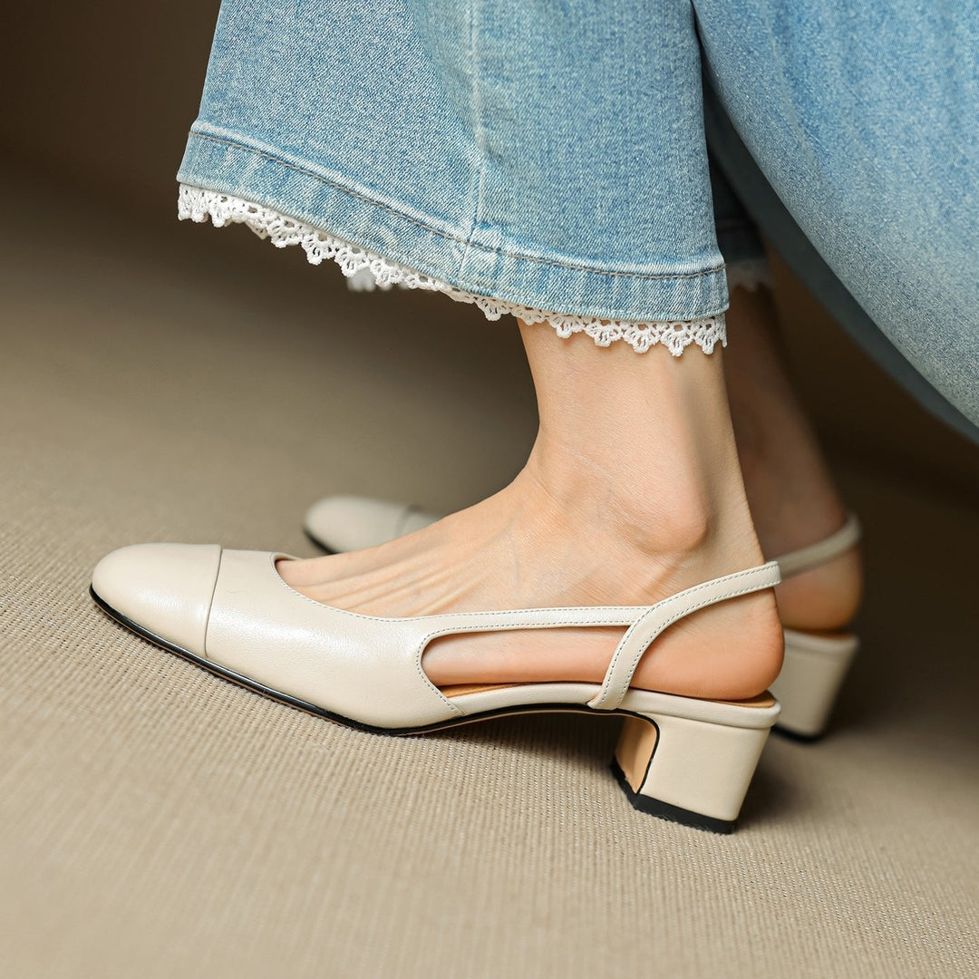 Front view: Elegant women's almond-toe block heels with classic slingback strap.