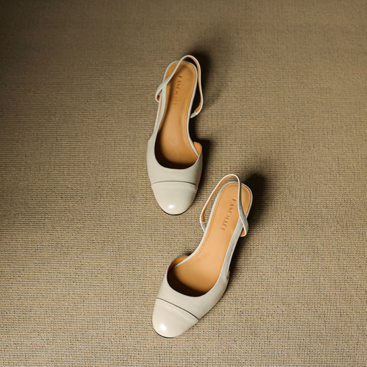 Close-up: Almond-toe detail on women's classic slingback block heels.