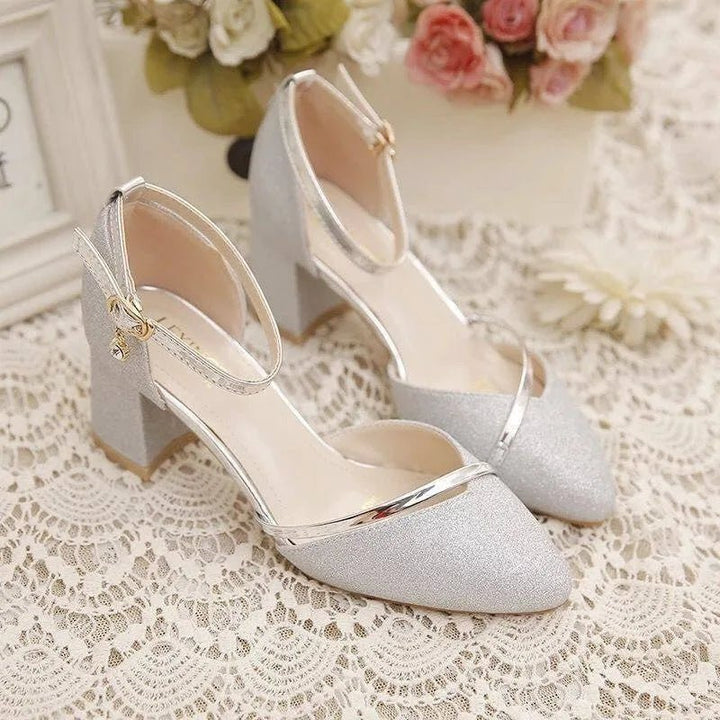 Classic pointed toe block heel pumps with elegant ankle strap. Perfect women's dress shoes for any event.