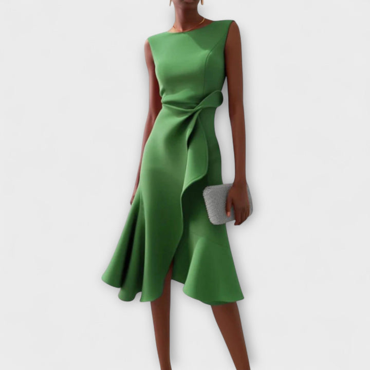 Beautiful women's elegant asymmetric pleated midi dress. Sleeveless formal and cocktail attire.