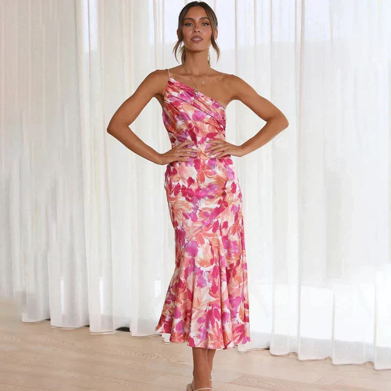 Chic pink floral asymmetrical one-shoulder midi dress, a stylish choice for summer party outfits.
