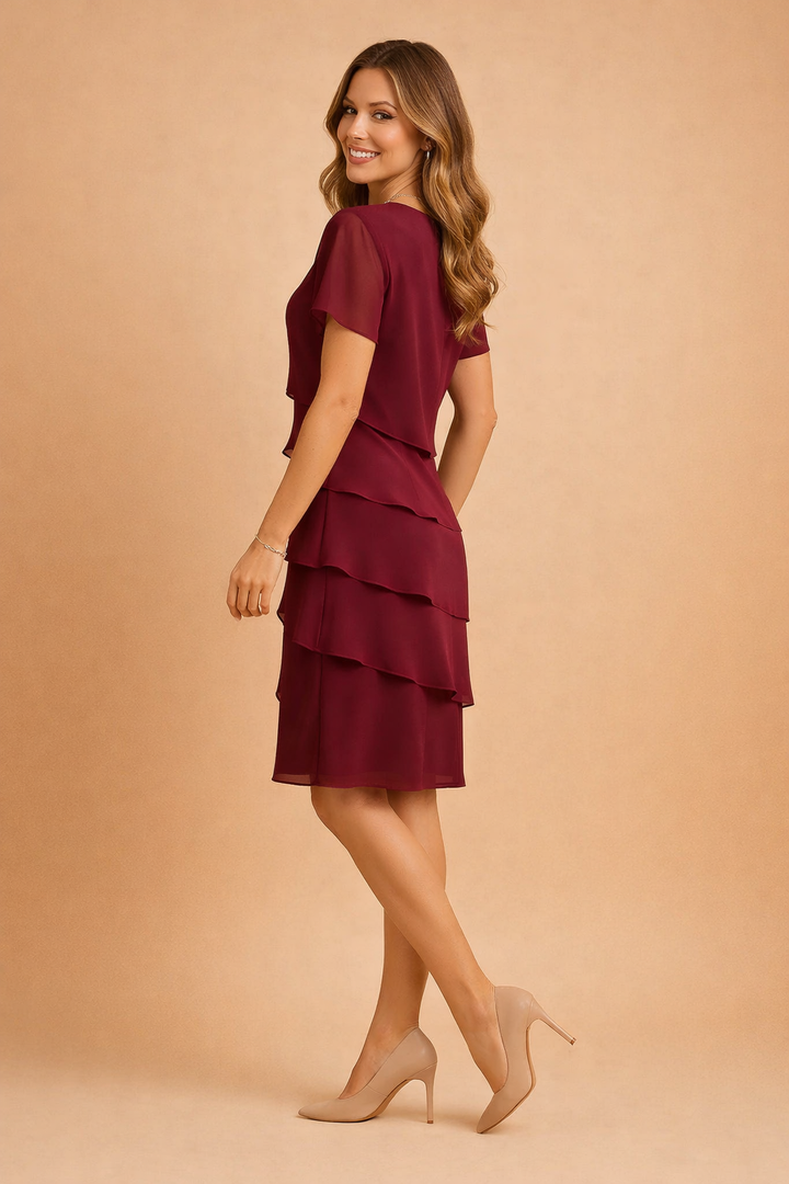 Flowy women's summer dress with elegant asymmetrical layers. A comfortable, flattering choice for chic fashion.