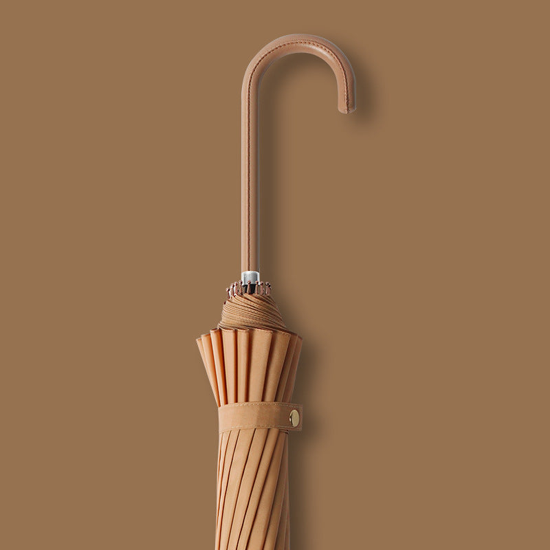 Auto-folding compact umbrella for women, windproof and elegant, ensuring quick rain protection.