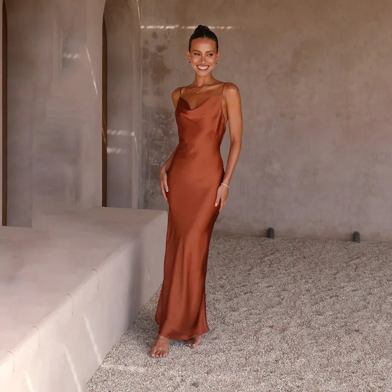 Occasionwear: Elegant women's backless maxi dress with high slit, perfect for formal events.