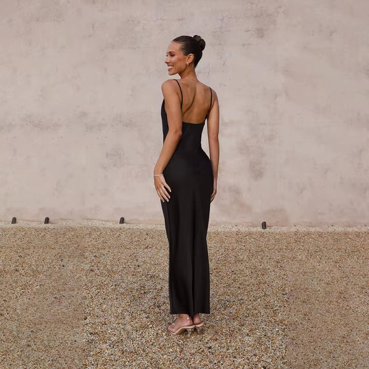 Chic women's backless maxi dress featuring a high slit, suitable for evening parties.