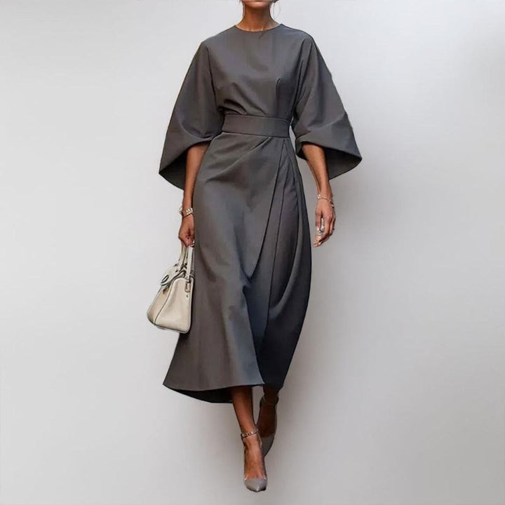 Modest long maxi dress for women, showcasing elegant batwing sleeves and a stylish, flowy silhouette.