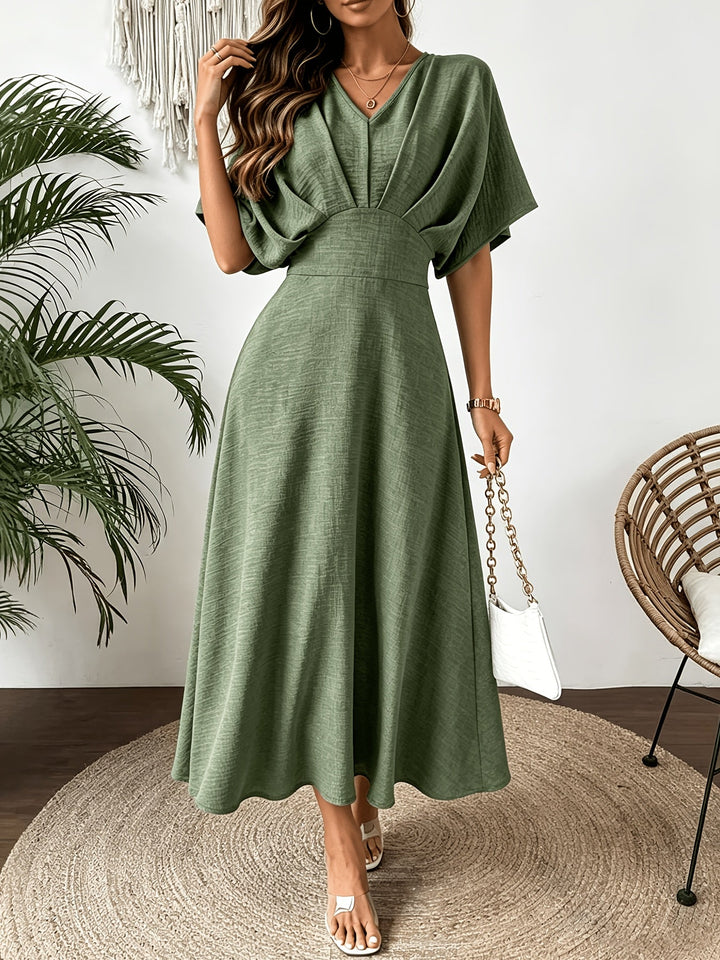 Elegant women's batwing sleeve ruffle V-neck midi dress. Flowing A-line design, perfect for summer fashion.