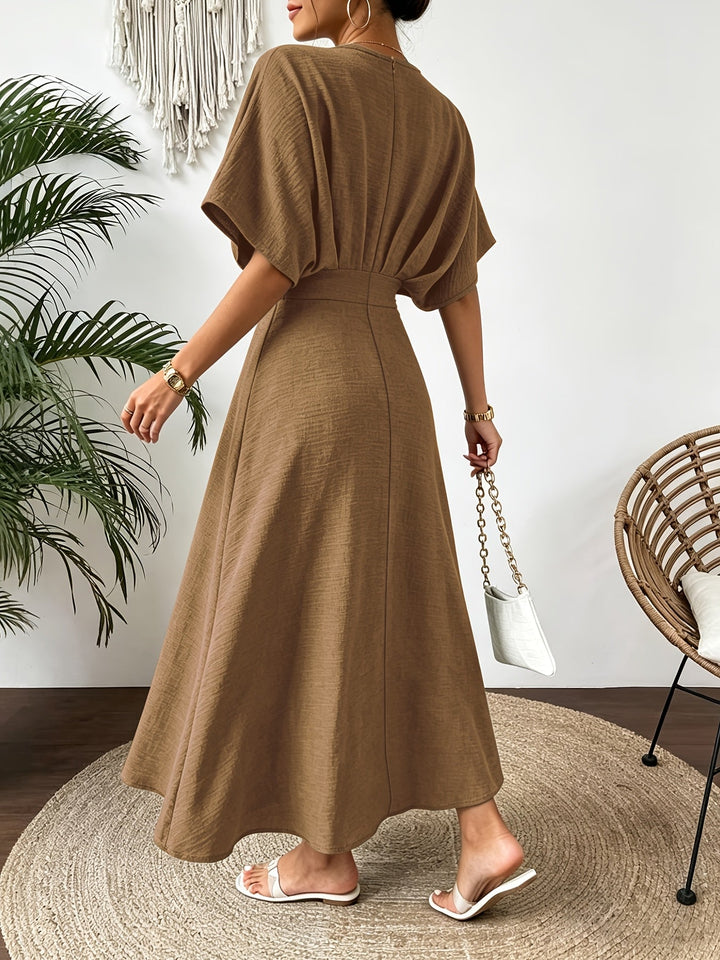 Side view: Flowy women's A-line midi dress with stylish batwing sleeves & a flattering ruffle V-neck.