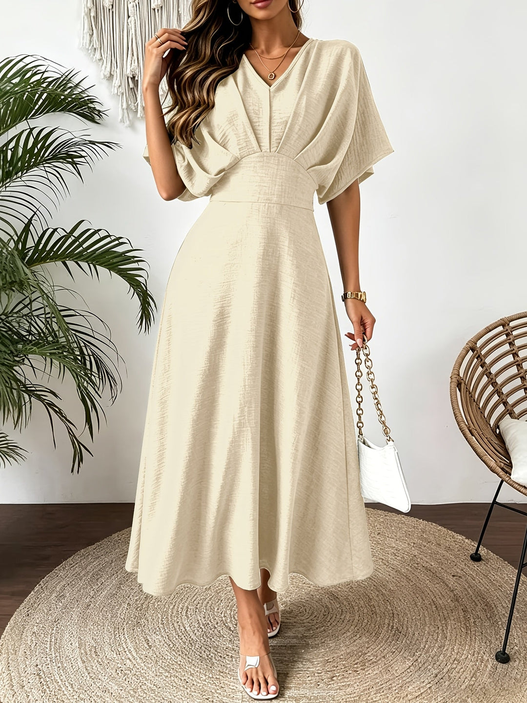Flowy A-line midi dress for women, featuring elegant batwing sleeves & a flattering ruffle V-neck.