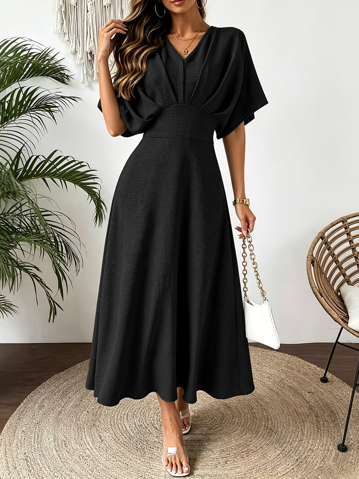 Women's elegant batwing sleeve midi dress. Ruffle V-neck, flowy fabric, ideal for occasion wear.