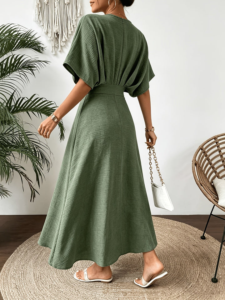 Women's party midi dress with elegant batwing sleeves & a graceful ruffle V-neck. Flowing summer fashion.