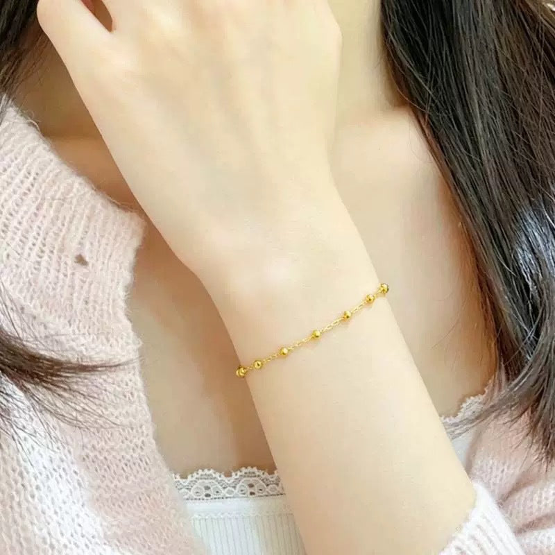 Stylish women's beaded gold-tone chain necklace, adjustable and elegant. A must-have fashion accessory.