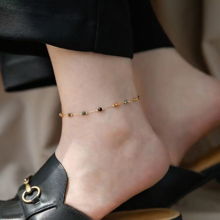 High-quality women's beaded jewelry set: elegant necklace, bracelet, and anklet for modern fashion.